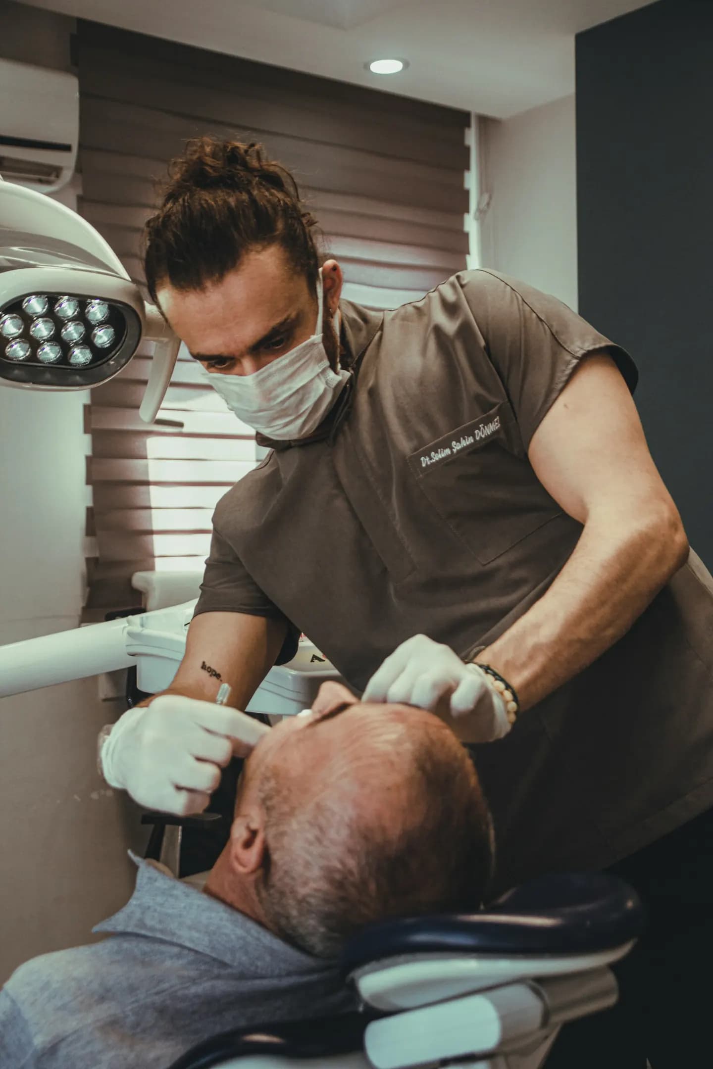 Dentist treating a patient in a modern clinic